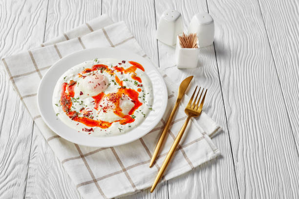istock cilbir, poached eggs in yogurt sauce topped with spicy butter 1206797845