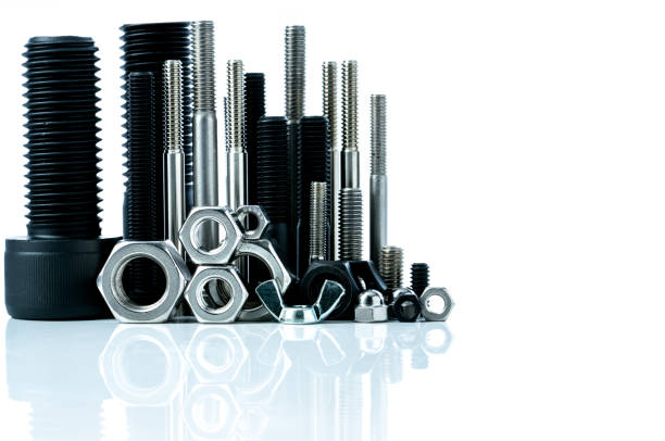 istock Metal bolts and nuts on white background. Fasteners equipment. Hardware tools. Stud bolt, hex nuts, and hex head bolts in workshop. Threaded fastener use in automotive engineering. Hexagonal bolt. 1206799117