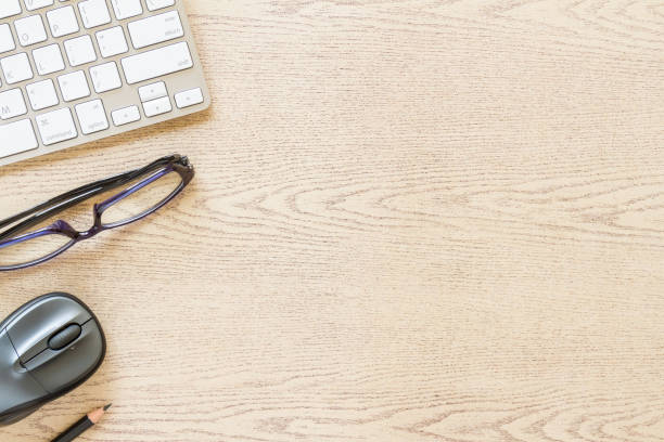 istock top view wooden office desk with computer and supplies 1206799134