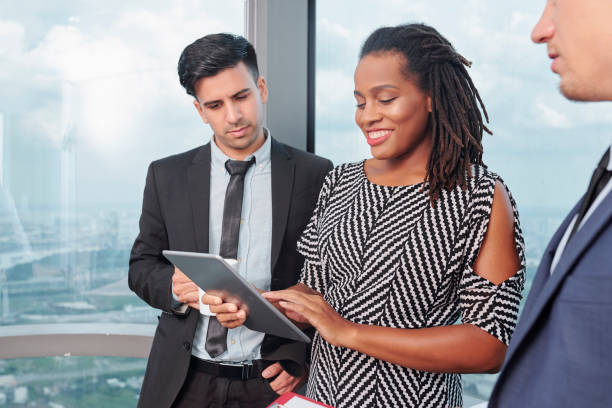 istock Businesswoman discussing project with colleagues 1206800725