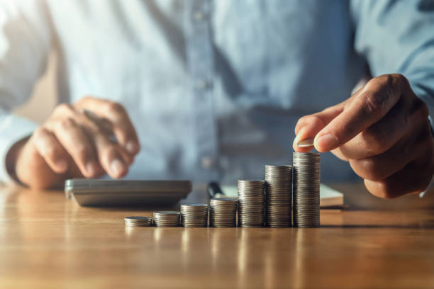 istock saving money with hand putting coins on stack concept financial 1206803507