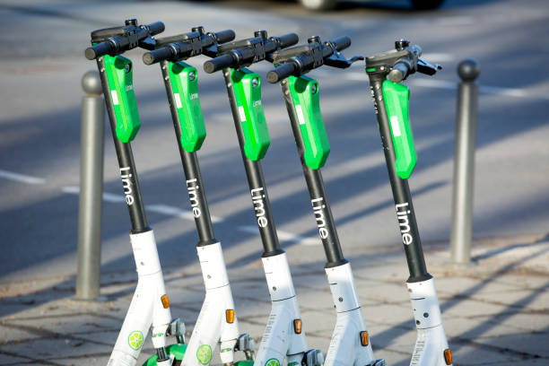 Electric push scooters Wiesbaden, Germany - February 15, 2020: Electric push scooters of Lime in the city center of Wiesbaden. Lime or Neutron Holdings, Inc. is a transportation company which runs electric scooters, electric bikes and car sharing systems in various cities around the world. Lime is based in San Francisco, USA lime scooter stock pictures, royalty-free photos & images