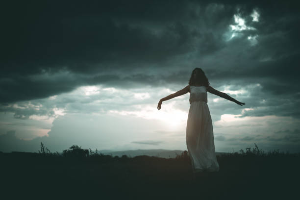 istock Young woman in grass field 1206804984