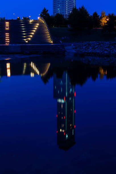 istock Skyscrapers and sky at dawn reflected in the pond 1206806623