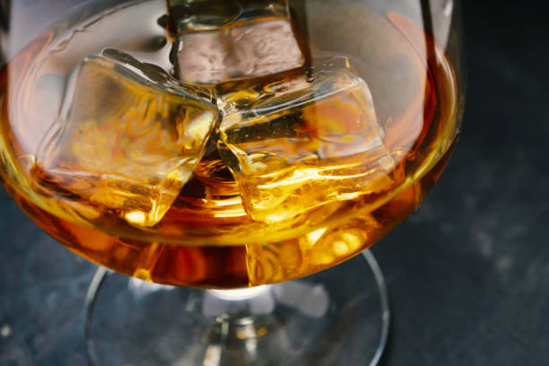 istock concrete table, ice cold, ice cubes, bourbon whiskey, whiskey scotch, shot glass 1206807596