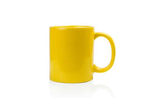 yellow ceramics cup isolated on white background with clipping path