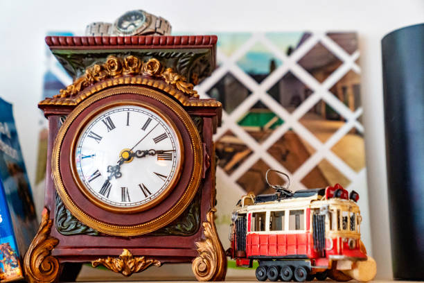 ретро часы и фигурка трамвай - roman numeral audio стоковые фото и изображения