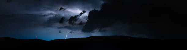 istock Storm raging in mountains with litghtning and thunder 1206813718