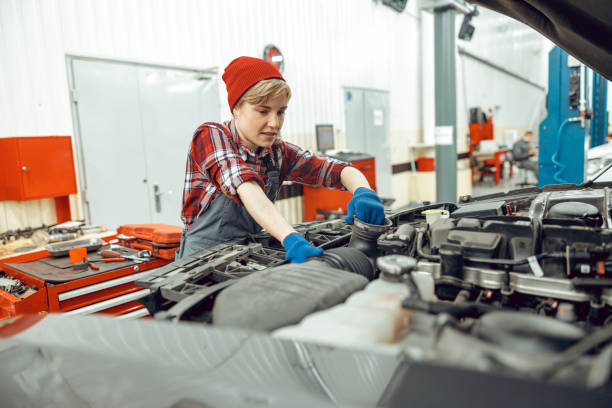 istock Technician working in an automobile repair shop 1206813877