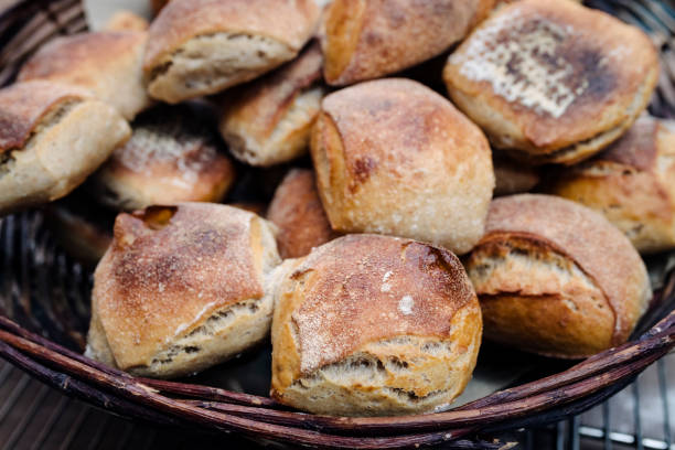 Sourdough bread is known for its characteristic flavour to it not using conventional yeast as a rising agent, instead a fermented culture of flour and water is used. The resultant bread has a chewy texture and a crisp crust. Photographed at an organic bakery on the island of Møn in Denmark. Colour, horizontal format with some copy space.