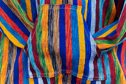 Colourful Moroccan jacket. Closeup, abstract background.