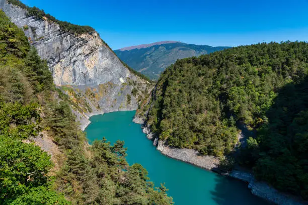 Lac de Monteynard Avignonet is an artificial water reservoir for the Electricite de France power station on the Drac River. It is bounded by the canyons of the Drac and Ebron in France