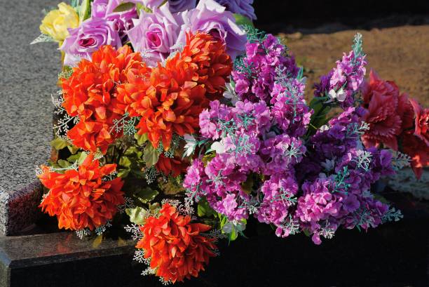 istock a bouquet of artificial colored and red flowers 1206820187