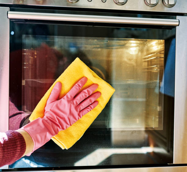 istock Woman is cleaning oven. 1206822322