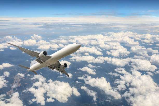 istock Airplane flying at high altitude and beautiful high-altitude clouds in spring 1206822386