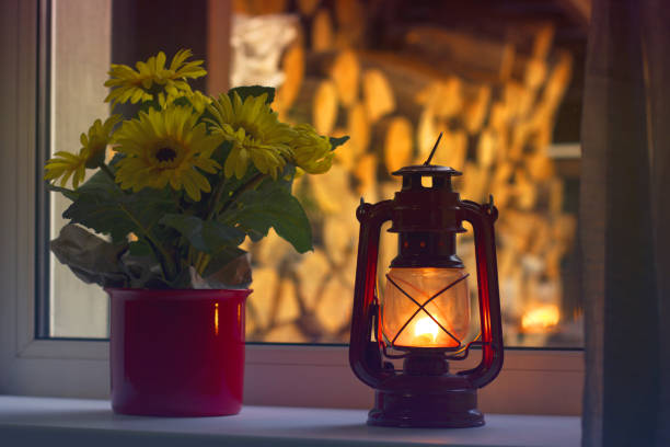 istock Kerosene lamp on the window. Old lamp 1206822406
