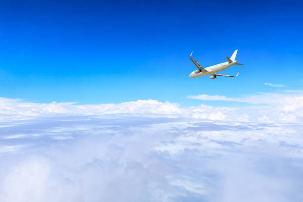 istock Airplane flying at high altitude and beautiful high-altitude clouds in spring 1206822511