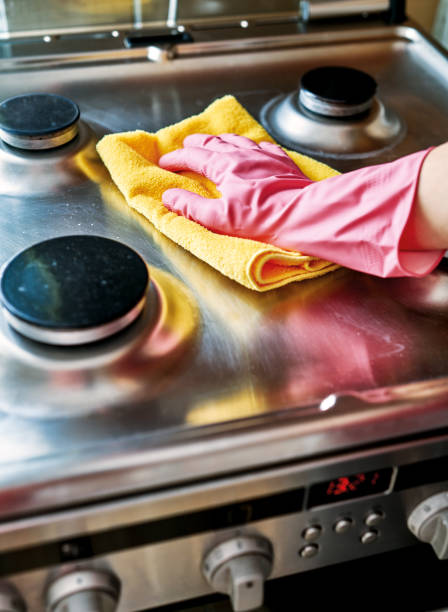 istock Woman is cleaning oven. 1206822540