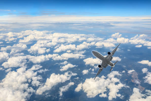 istock Airplane flying at high altitude and beautiful high-altitude clouds in spring 1206822552