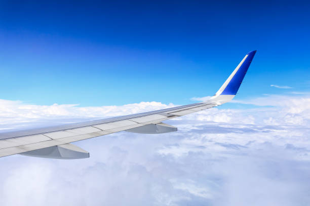 istock Airplane flying at high altitude and beautiful high-altitude clouds in spring 1206822609