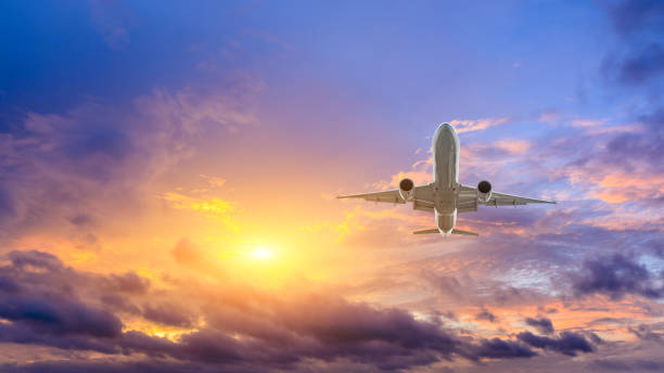 istock High-altitude airplane and beautiful sky at dusk 1206822613