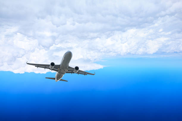 istock Airplane flying at high altitude and beautiful high-altitude clouds in spring 1206822627