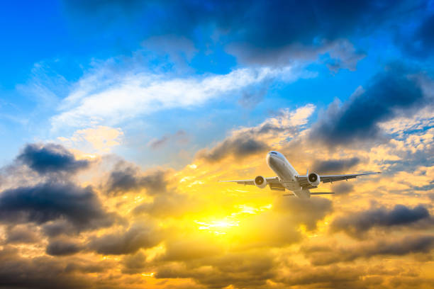 istock High-altitude airplane and beautiful sky at dusk 1206822628