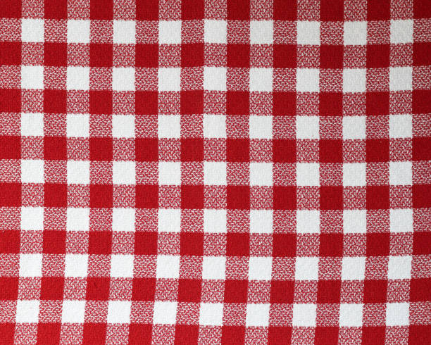 istock Gingham. Red and white checkered fabric made of cotton. 1206822677