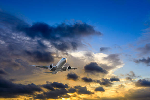 istock High-altitude airplane and beautiful sky at dusk 1206822898