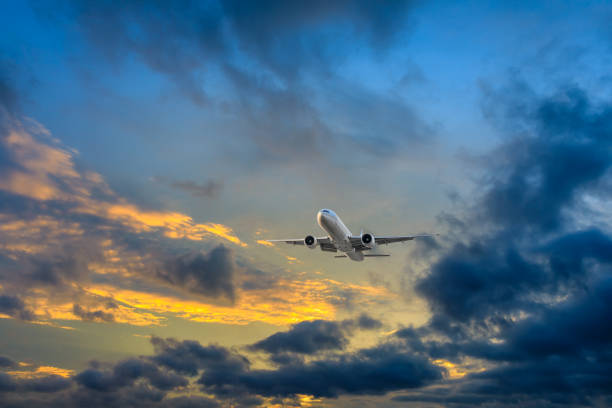 istock High-altitude airplane and beautiful sky at dusk 1206823459