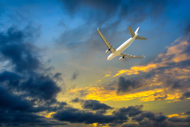 istock High-altitude airplane and beautiful sky at dusk 1206823507
