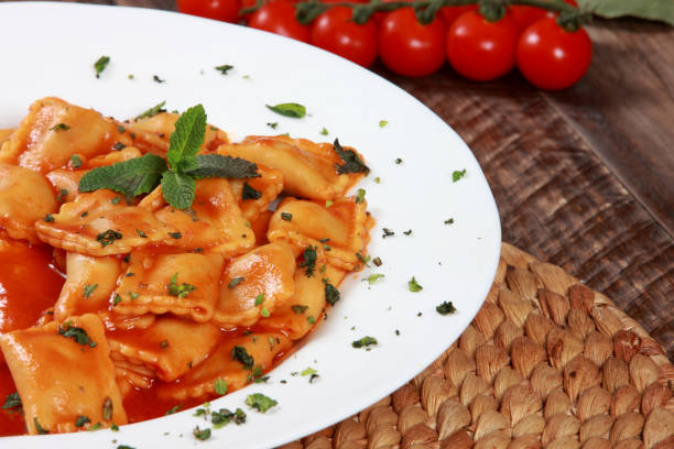istock Ravioli Pasta with Tomato Sauce sprinkled with Spinach Mint and Basil 1206823711