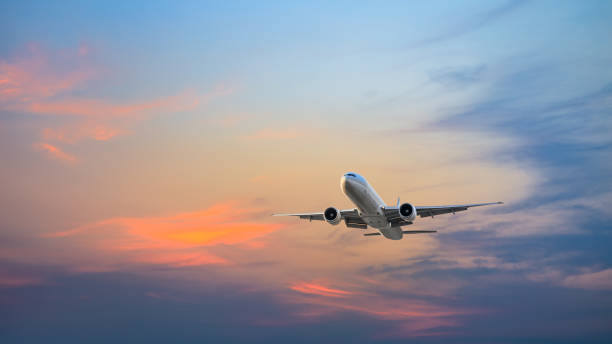 istock High-altitude airplane and beautiful sky at dusk 1206823740