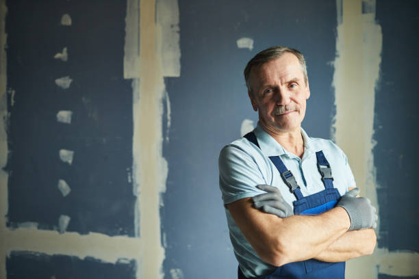 istock Senior Worker Posing with Arms Crossed 1206823748