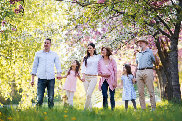 istock Three generation family walking outside in spring nature. 1206823775