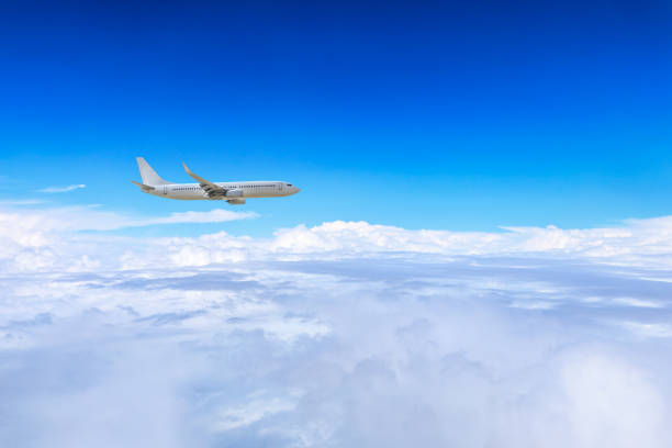 istock Airplane flying at high altitude and beautiful high-altitude clouds in spring 1206824278