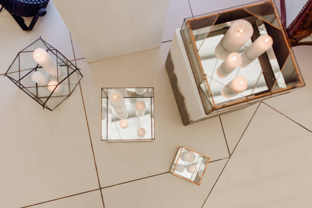 istock Burning Candles Staying on Marble Floor in Boxes 1206824446