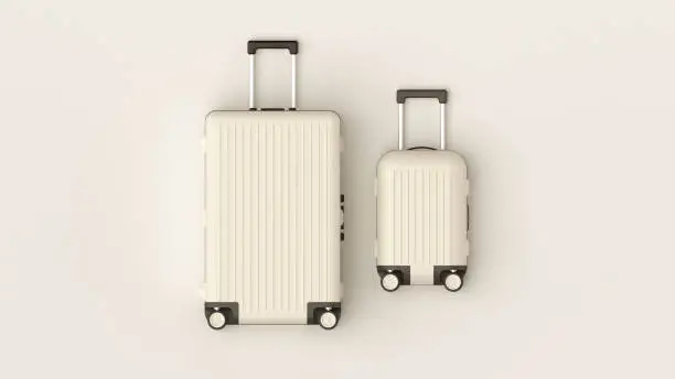 Photo of White luggage set on white background, top view image, flat lay composition. Travel minimalist concept, black and white classic baggage mockup, small and big. Suitcase accessory set, journey concept.