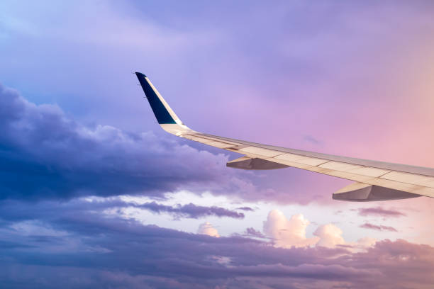 istock High-altitude airplane and beautiful sky at dusk 1206824655