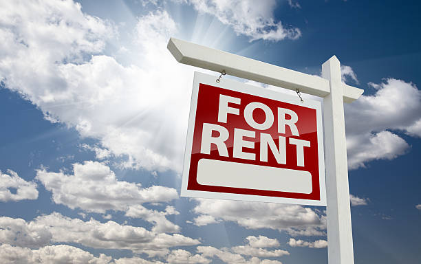 istock Left Facing For Rent Real Estate Sign Over Sunny Sky 120682587
