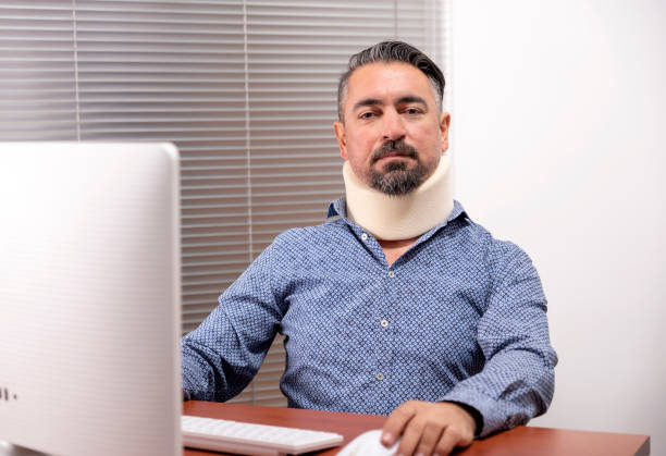 istock middle aged man with a neck brace 1206826699