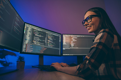 Low below angle view photo of cheerful woman finishing developing, computer game solving all the current problems