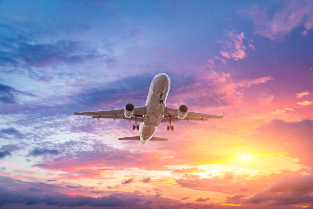istock High-altitude airplane and beautiful sky at dusk 1206827018