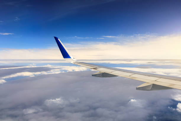 istock Airplane flying at high altitude and beautiful high-altitude clouds in spring 1206827024