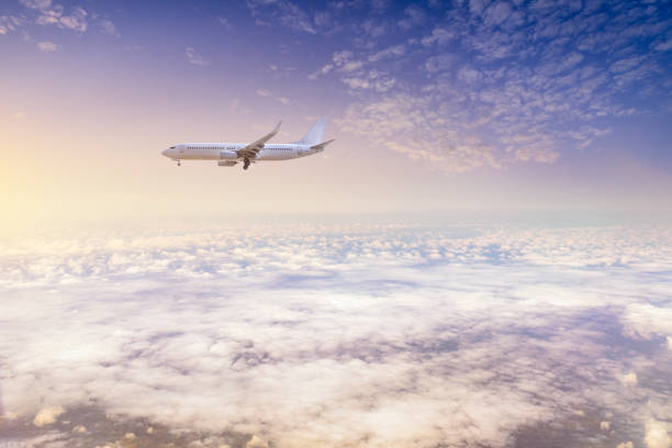 istock High-altitude airplane and beautiful sky at dusk 1206828082