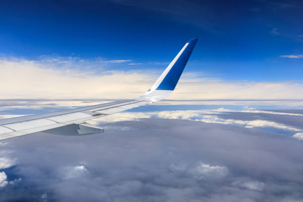 istock Airplane flying at high altitude and beautiful high-altitude clouds in spring 1206828708