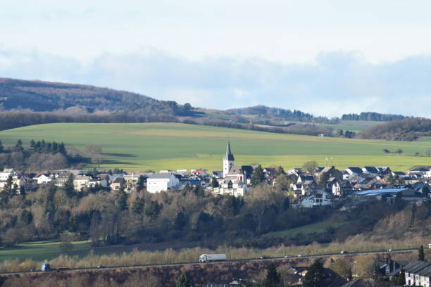 istock view across a green valley with a village in the Eifel 1206828733