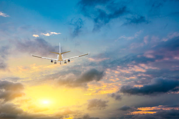 istock High-altitude airplane and beautiful sky at dusk 1206829521
