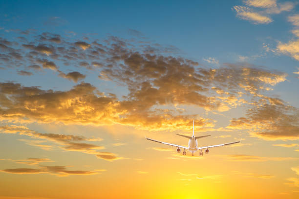 istock High-altitude airplane and beautiful sky at dusk 1206832132