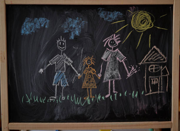istock Children multicolored chalk drawing on blackboard 1206834315